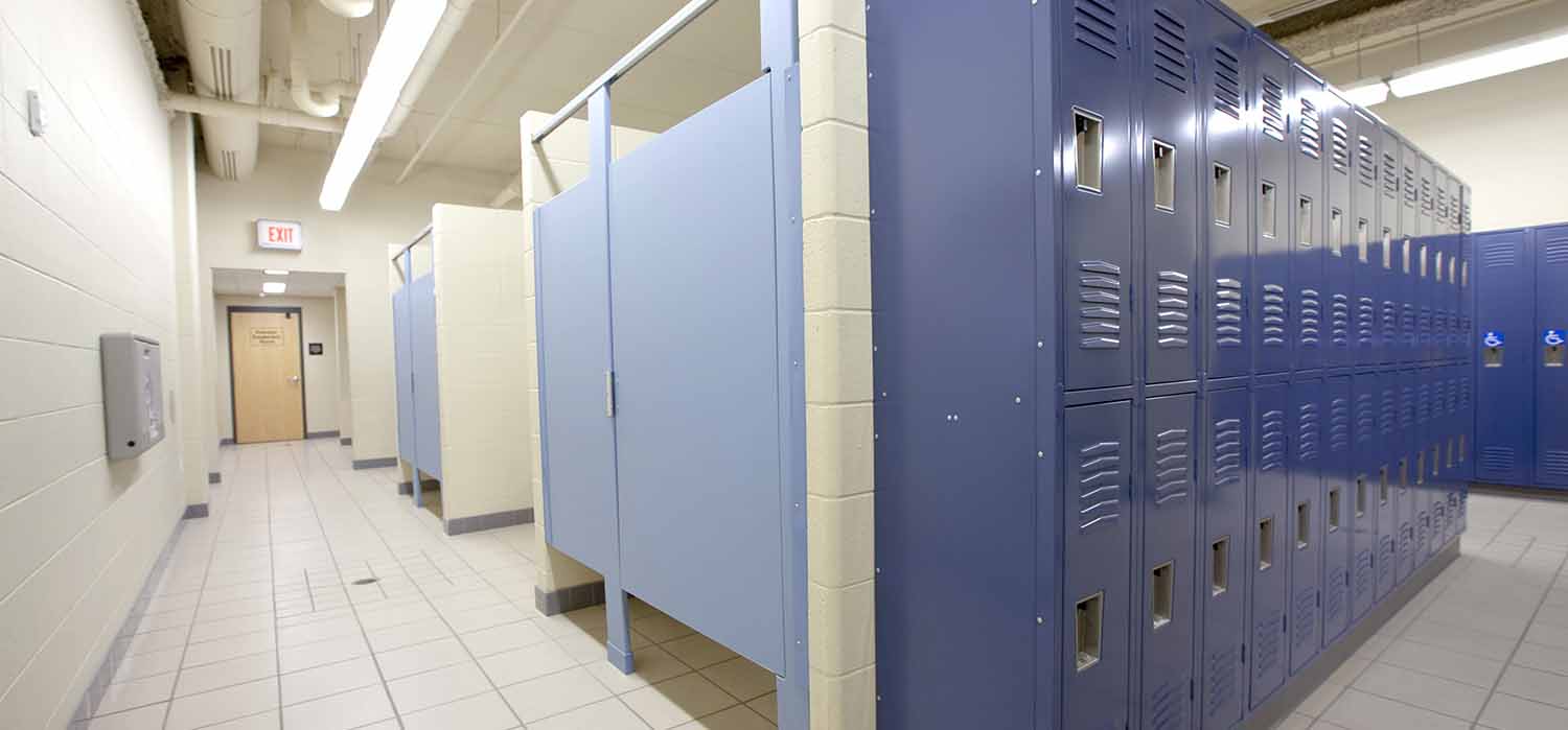 blue bathroom partitions and lockers