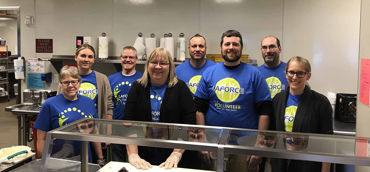 LaForce Inc. employees in kitchen donating time for volunteer event