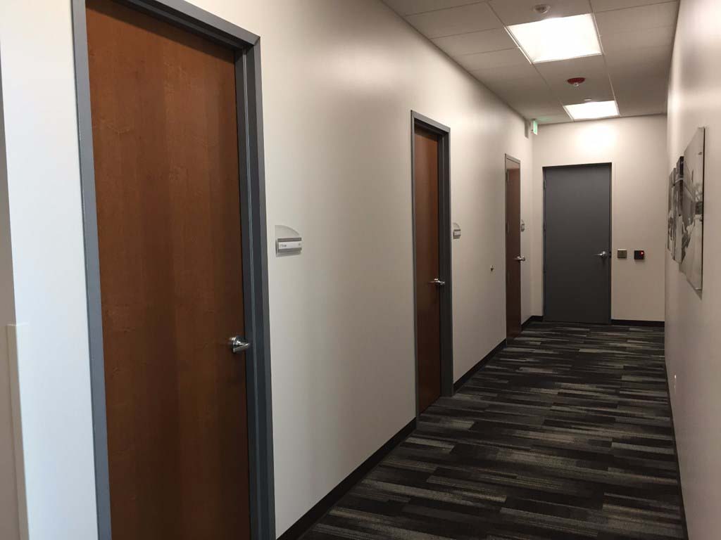 Festival Foods Support Office hallway lined with custom doors and frames supplied by LaForce Inc.